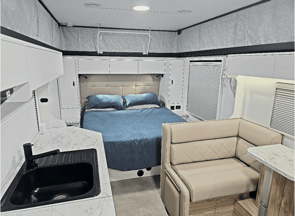 Bed and lounge inside a Goldstream RV 1760 pop-top caravan
